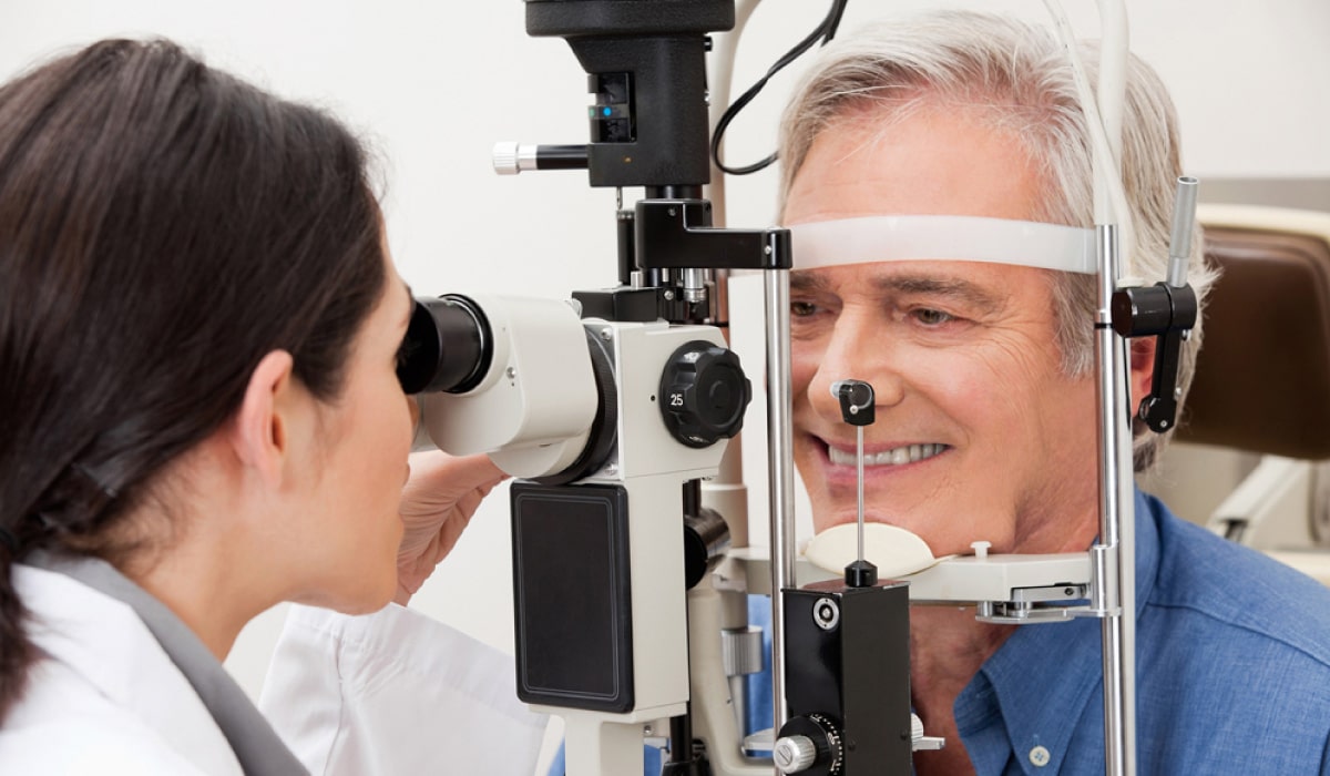 man smiling getting a glaucoma exam